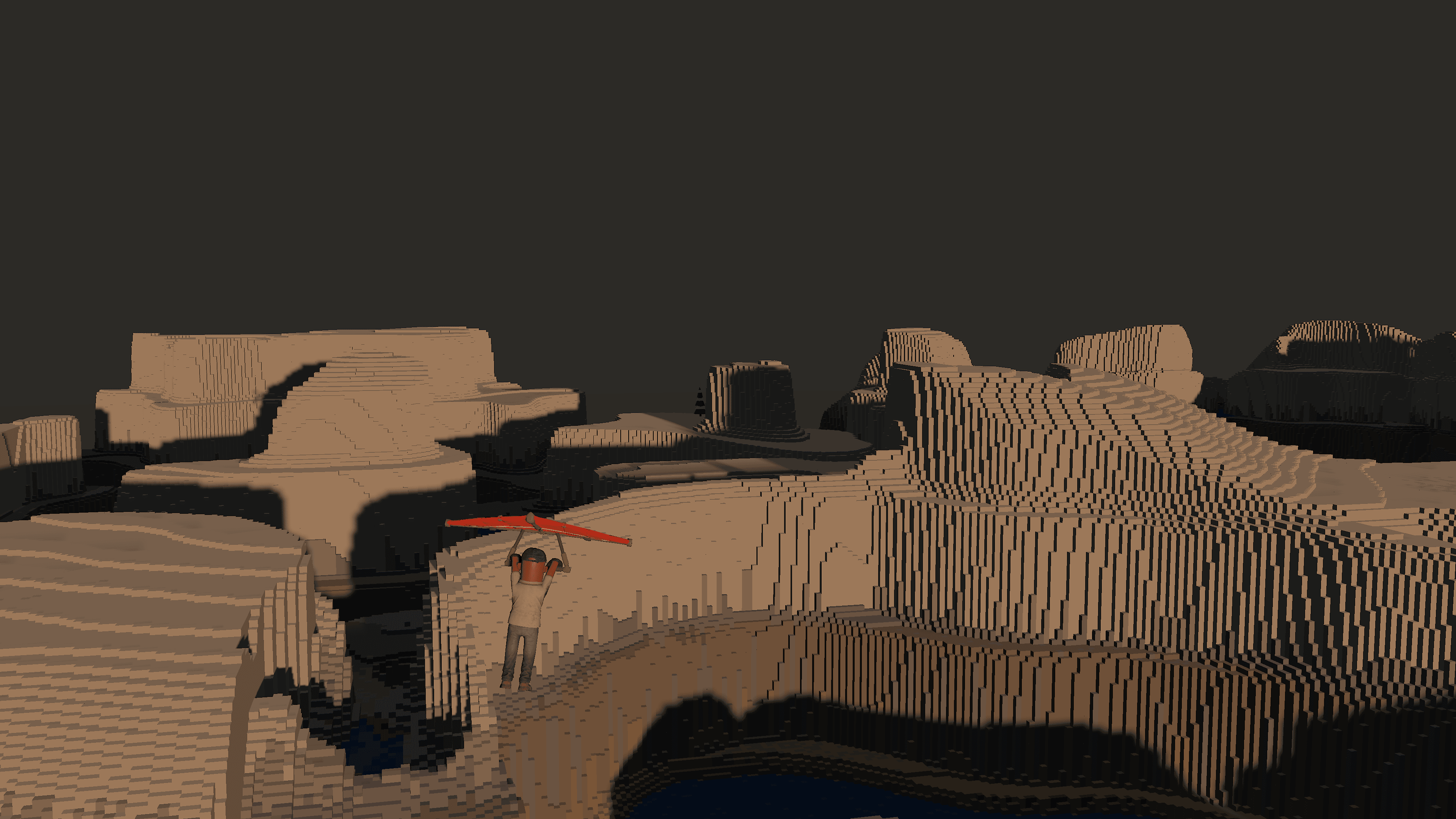 Glider launching off a mesa edge at dusk