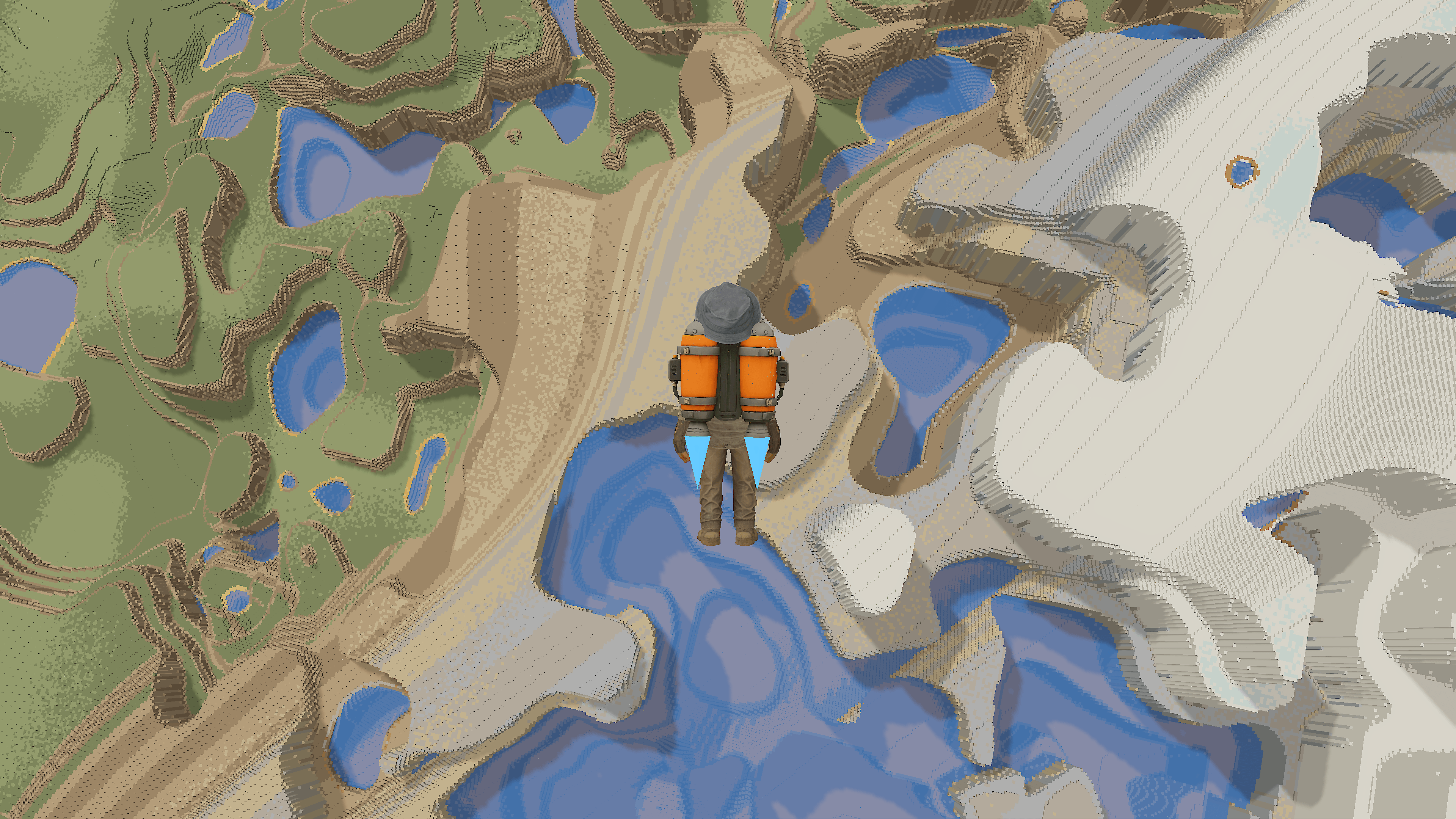 Player jetpacking high above a voxel world where grassland, desert, and snow biomes meet around blue lakes